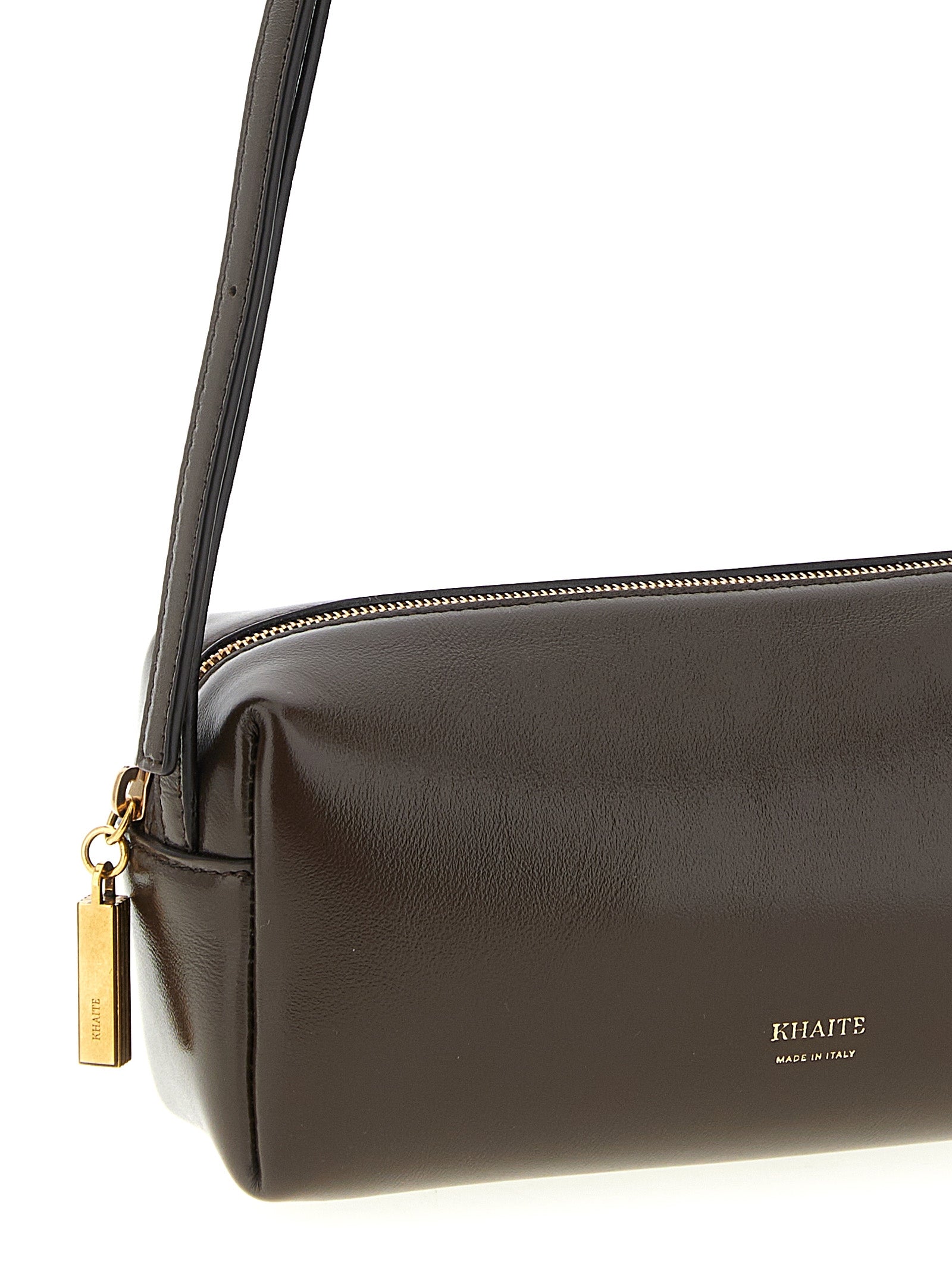 Mini East West Crossbody Handbag by Khaite for women in calfskin leather brown features a transformative sophistication silhouette, showcasing a secure zipper, ample , and versatile crossbody-strap, shoulder-strap & adjustable-strap for a transformative sophistication look.