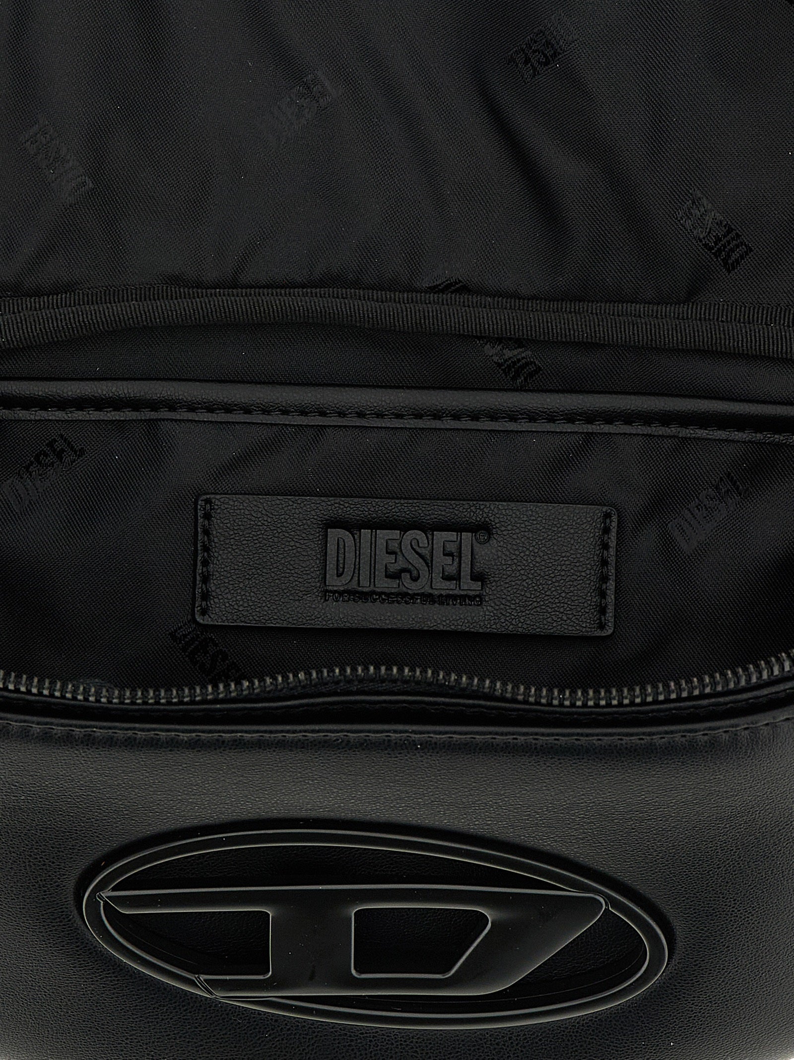 This Crossbody Messenger Bag by Diesel for men in polyethylene & polyurethane black presents a versatile silhouette from the Holi D Polyethylene & Polyurethane Crossbody Messenger Bag collection, featuring a secure , ample , and versatile crossbody-strap, shoulder-strap & adjustable-strap.