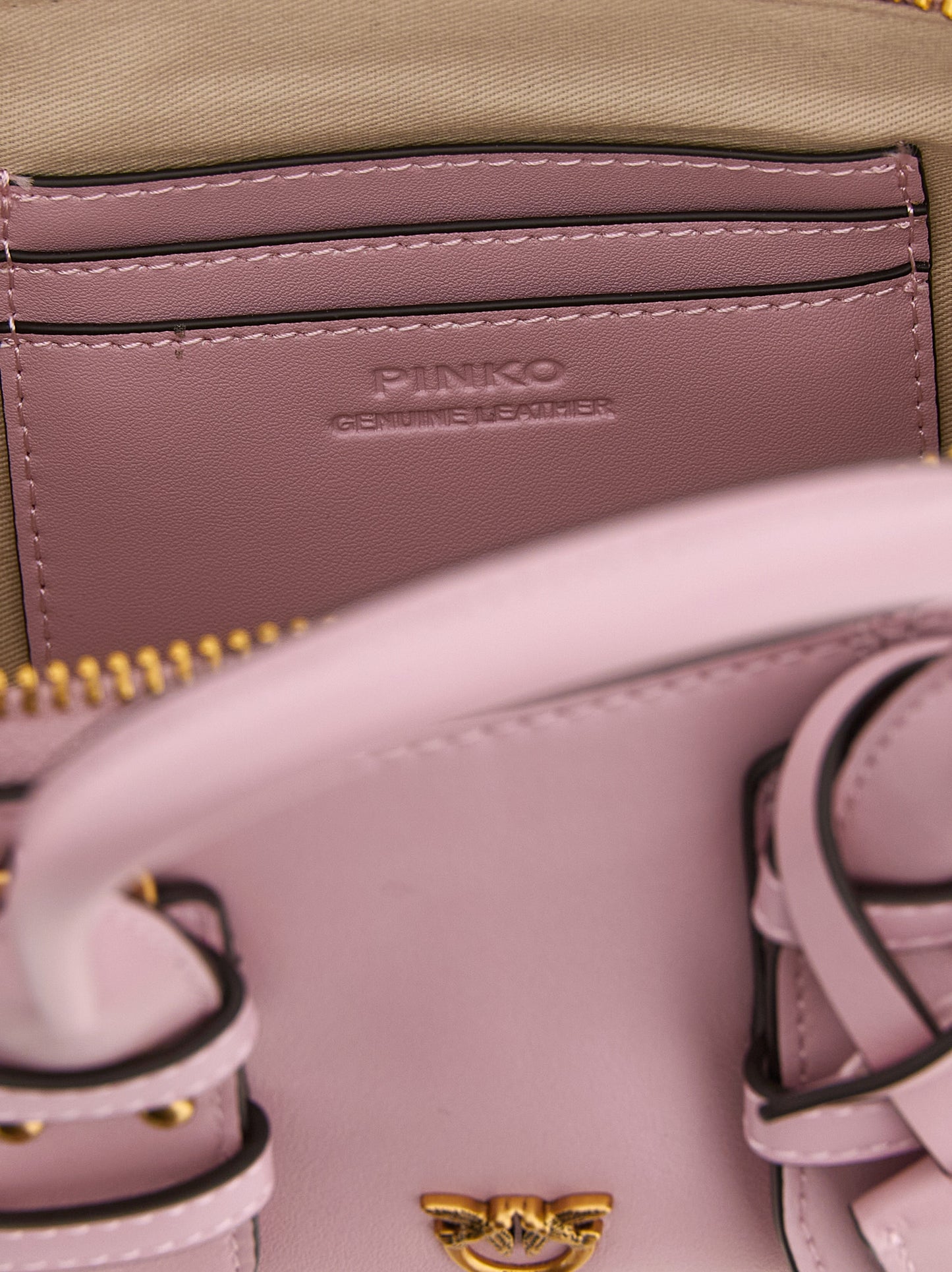 This Bowling Baguette Handbag by PINKO for women in leather & cotton and multicolor & pink presents a sculptural silhouette featuring a secure zipper, ample , and versatile shoulder-strap, adjustable-strap & handle for a sculptural finish.