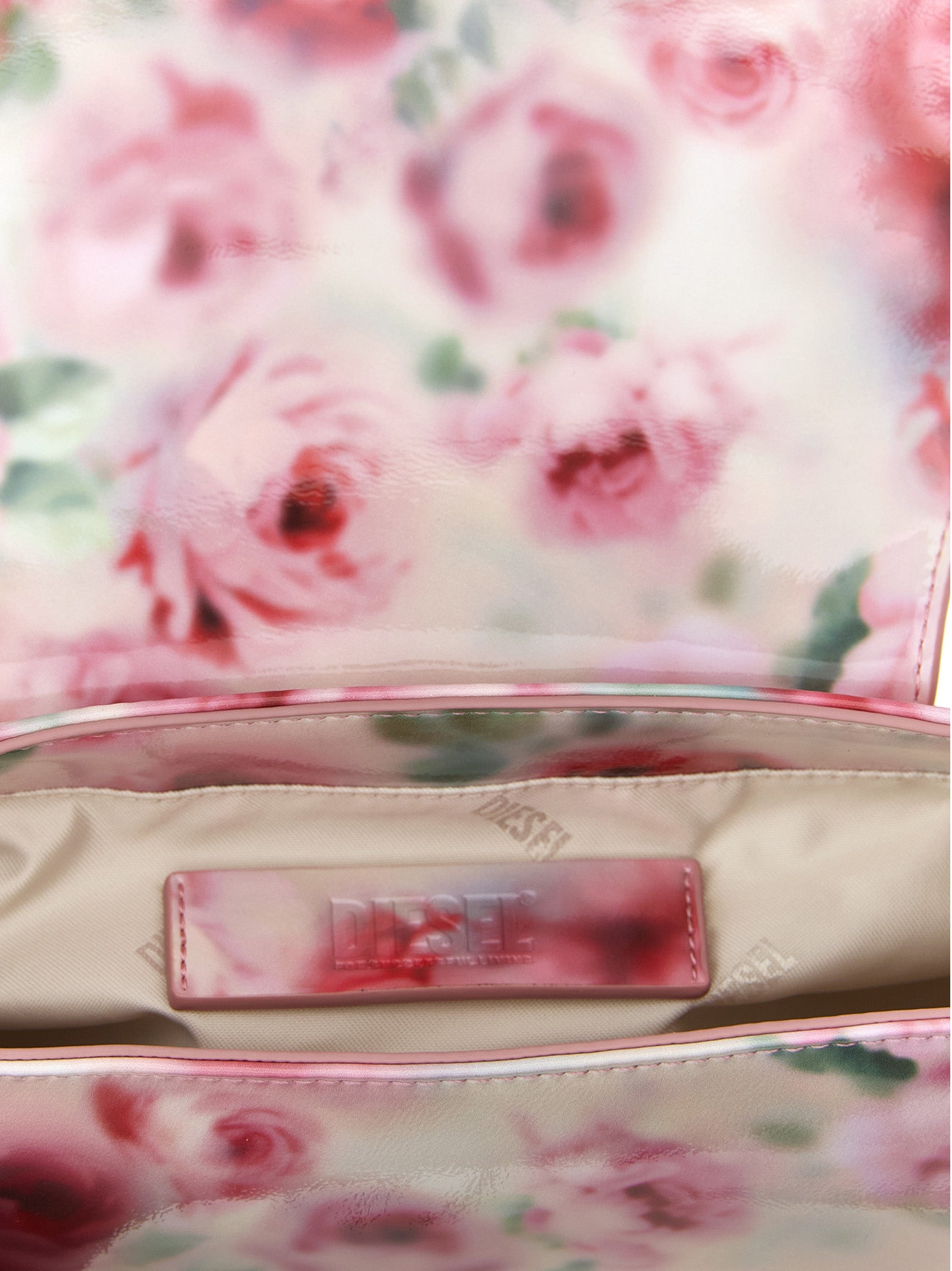2-in-1 Shoulder & Crossbody Flap Bag by Diesel for women in polyethylene & polyurethane multicolor & print presents a statuesque silhouette, showcasing a secure flap & magnetic and statuesque with versatile crossbody-strap, shoulder-strap, adjustable-strap & handle for a sophisticated look.