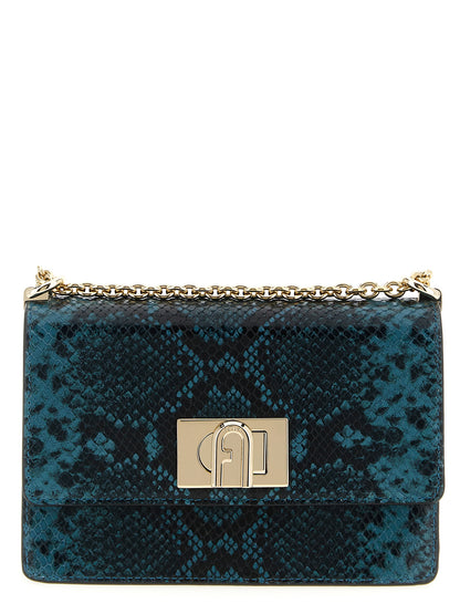 Mini Crossbody Flap Handbag by Furla for women in calfskin leather blue features a transformative elegance silhouette, showcasing a secure flap, organized , and versatile crossbody-strap & shoulder-strap for a transformative elegance look.