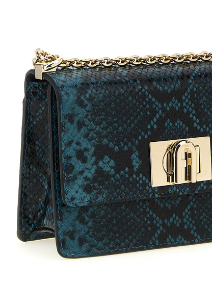 Mini Crossbody Flap Handbag by Furla for women in calfskin leather blue features an multi-faceted design with a secure flap, ample , and versatile crossbody-strap & shoulder-strap for a multi-faceted finish.