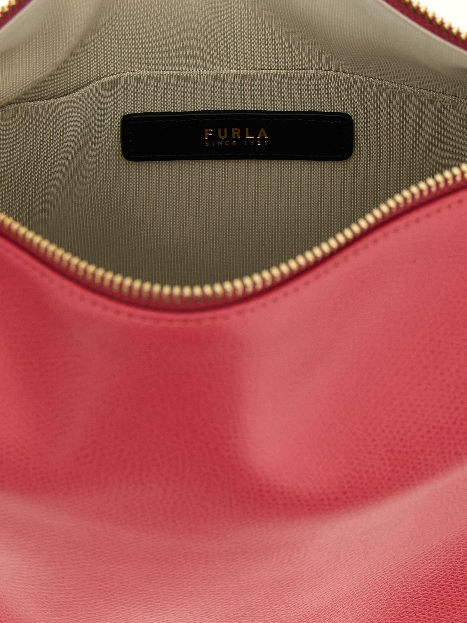 Shoulder Bag by Furla for women in calfskin leather fuchsia, signature & print showcases a statuesque silhouette, artfully detailed with a secure zipper, organized , and versatile shoulder-strap, adjustable-strap, detachable-strap & handle for a statuesque look.
