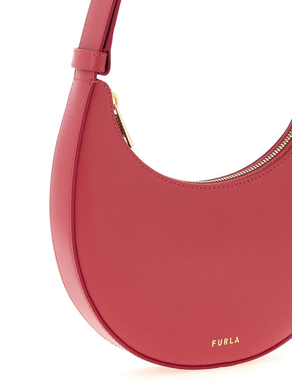 Mini Shoulder Crescent Bag by Furla for women in bos taurus calf suede leather fuchsia showcases a statuesque silhouette, artfully detailed with a secure zipper, organized , and versatile shoulder-strap, adjustable-strap & handle for a statuesque look.