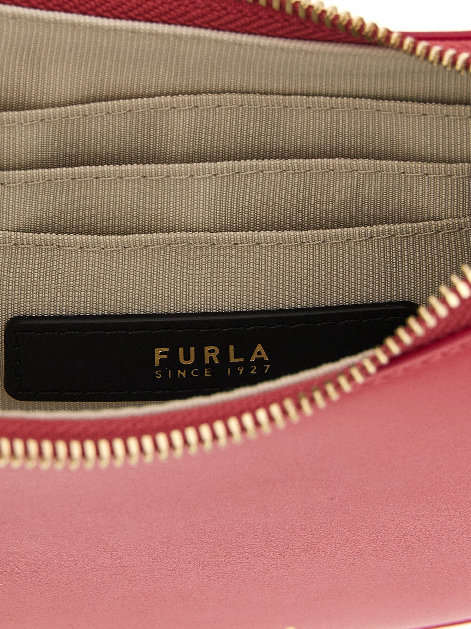Mini Shoulder Crescent Bag by Furla for women in bos taurus calf suede leather fuchsia features a stately silhouette, showcasing a secure zipper, ample , and stately shoulder-strap, adjustable-strap & handle for a stately finish.