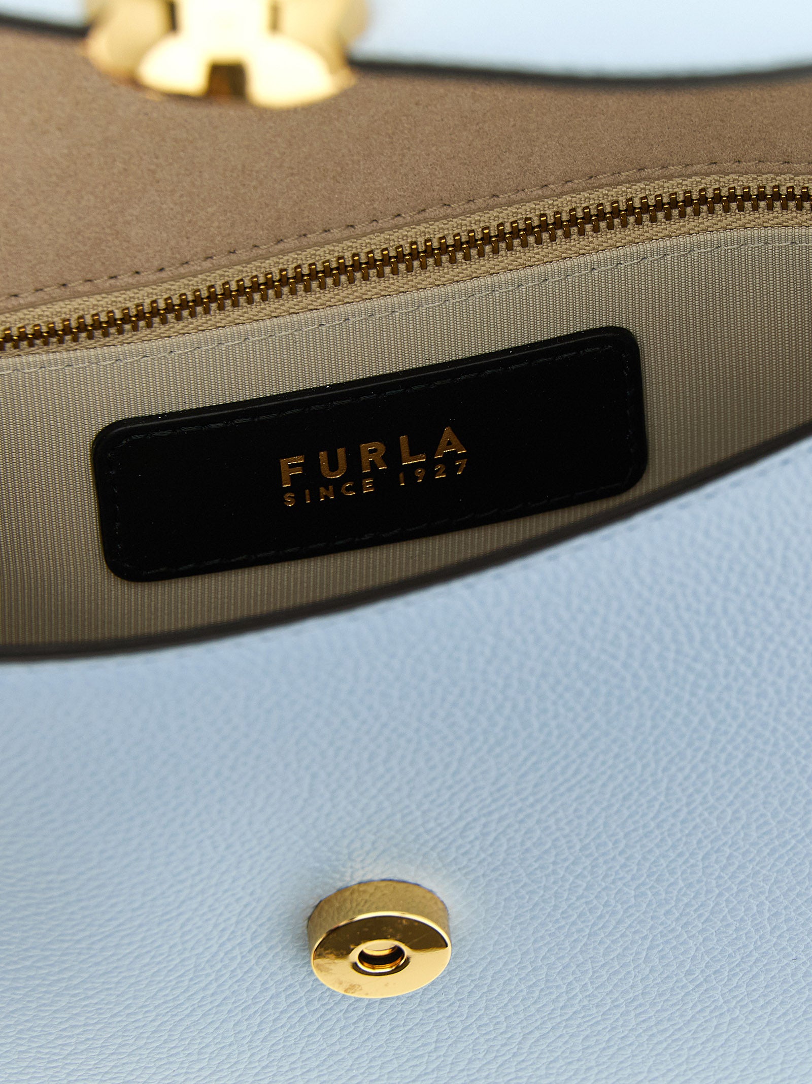 Crossbody Flap Handbag by Furla for women in calfskin leather light-blue features a transformative elegance silhouette, showcasing a secure flap & magnetic, organized , and versatile crossbody-strap, shoulder-strap & adjustable-strap for a transformative elegance look.