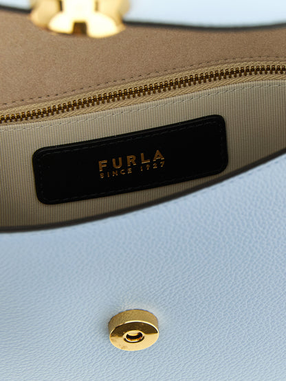 Crossbody Flap Handbag by Furla for women in calfskin leather light-blue features a transformative elegance silhouette, showcasing a secure flap & magnetic, organized , and versatile crossbody-strap, shoulder-strap & adjustable-strap for a transformative elegance look.