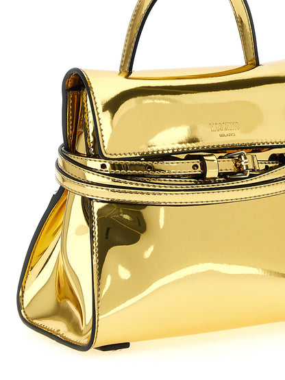 This Handbag by Moschino for women in polyester & polyethylene and gold presents a sculptural silhouette featuring a secure buckle & button, ample , and versatile shoulder-strap, adjustable-strap & handle for a sculptural finish.