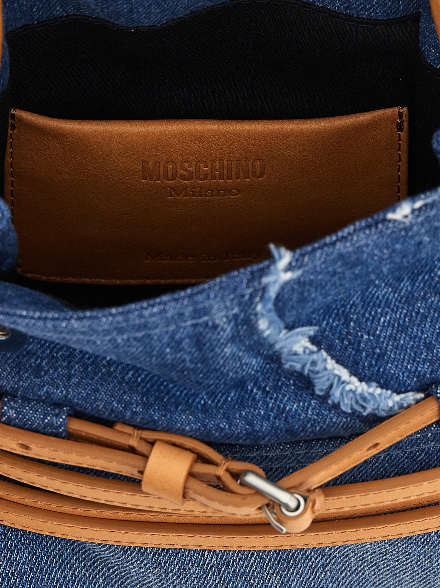Handbag by Moschino for women in calf leather & cotton blue features a exquisite silhouette, showcasing a secure buckle & button and exquisite with versatile shoulder-strap, adjustable-strap & handle for a exquisite finish.