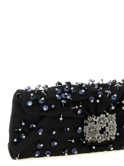Flap Clutch Handbag by Roger Vivier for women in polyurethane black & floral showcases a sculptural silhouette, featuring a secure flap, magnetic & buckle, ample , and versatile for a sculptural aesthetic.