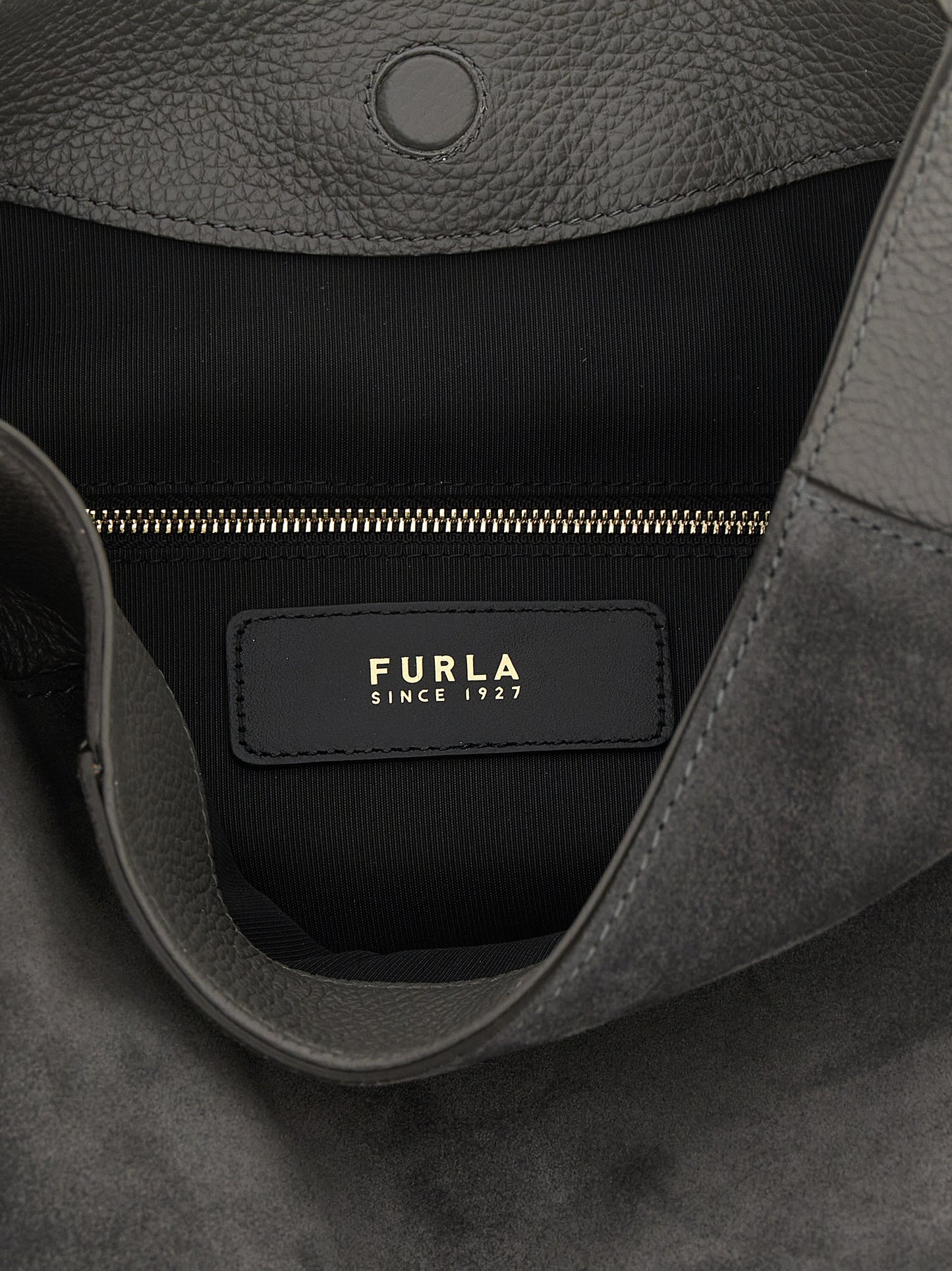 Medium Shoulder Bag by Furla for women in calfskin leather gray presents a statuesque silhouette, showcasing a secure magnetic and statuesque with versatile shoulder-strap & handle for a sophisticated look.