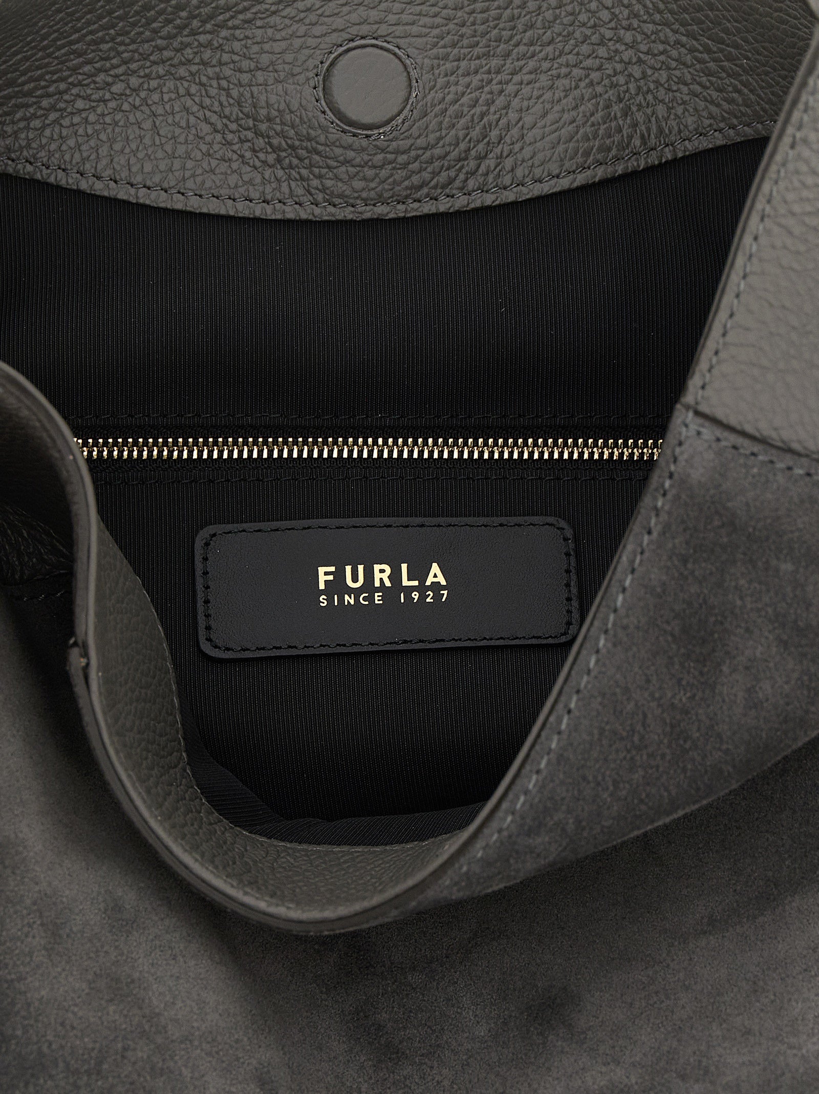 Medium Shoulder Bag by Furla for women in calfskin leather gray presents a statuesque silhouette, showcasing a secure magnetic and statuesque with versatile shoulder-strap & handle for a sophisticated look.