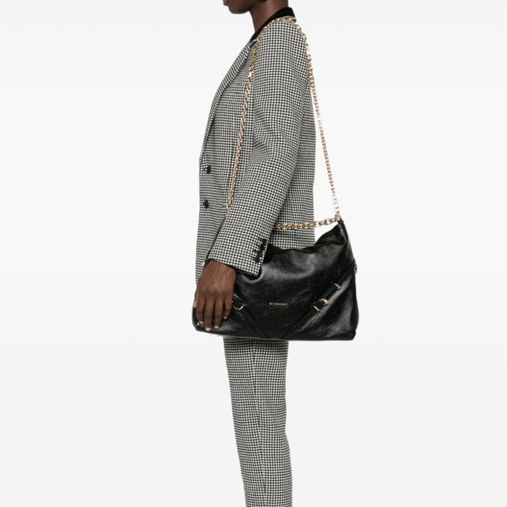 Shoulder Bag by Givenchy for women in calfskin leather & cotton black & gold features a statuesque silhouette, showcasing a secure and statuesque with versatile shoulder-strap & adjustable-strap for a statuesque finish.