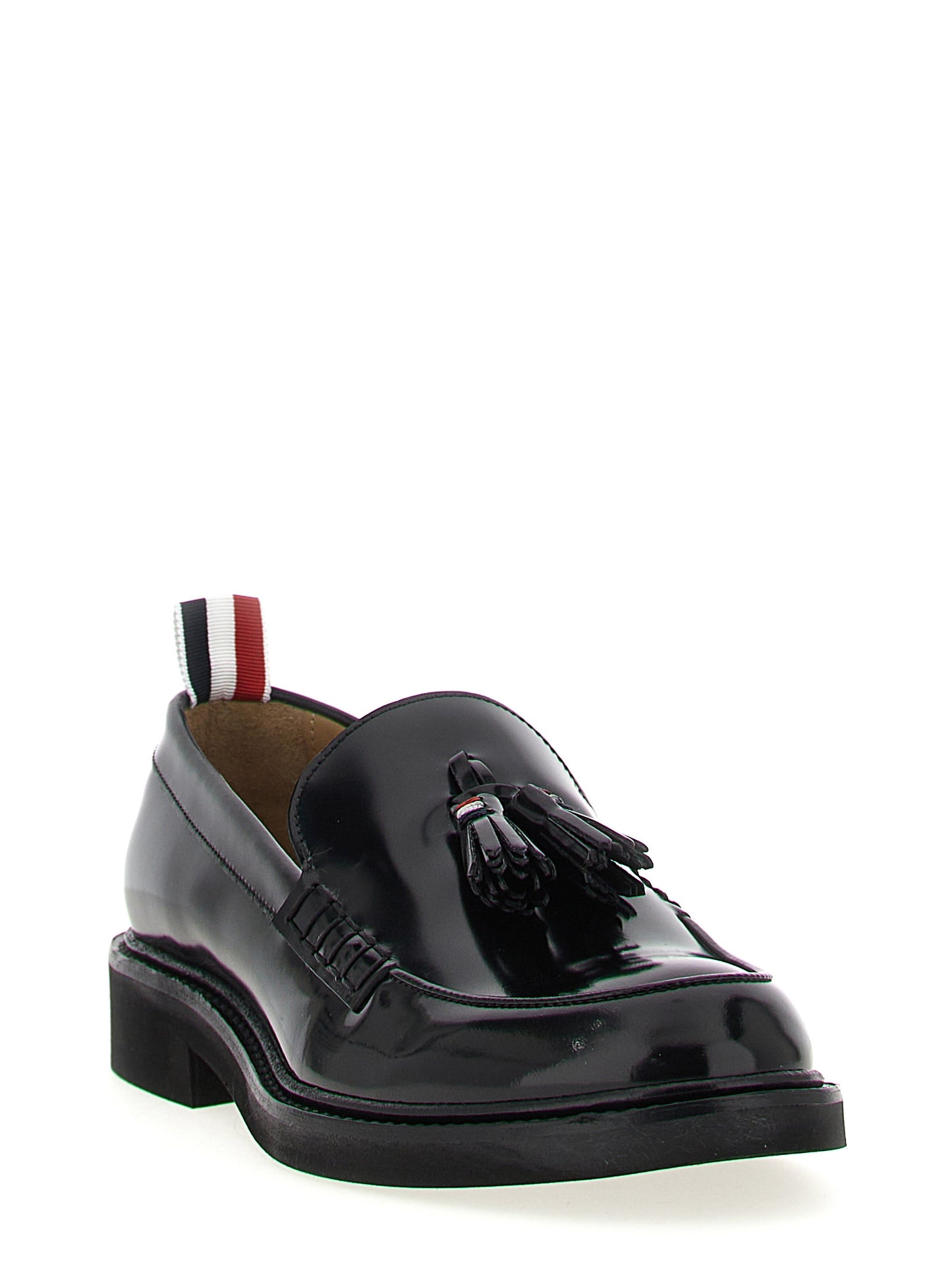 This Flat Loafer Slip-On Shoes by Thom Browne for women in bos taurus calfskin leather black & signature features an exquisite silhouette from the Women's Bos Taurus Calfskin Leather Flat Loafer Slip-On Shoes collection, defined by a sophisticated flat and elegant .