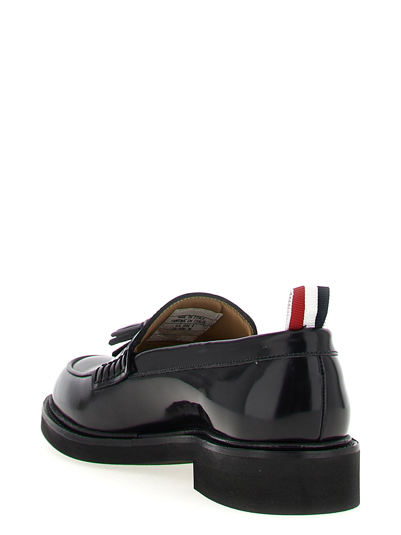 Flat Loafer Slip-On Shoes by Thom Browne for women in bos taurus calfskin leather black & signature features an effortless chic silhouette, showcasing the Women's Bos Taurus Calfskin Leather Flat Loafer Slip-On Shoes design with an effortless chic flat and a for a effortless chic look.