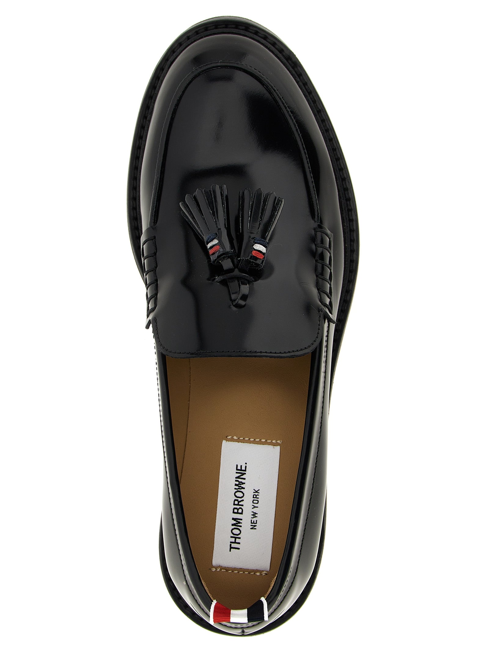 Flat Loafer Slip-On Shoes by Thom Browne for women in bos taurus calfskin leather black & signature features an ergonomic silhouette, perfectly showcasing Women's Bos Taurus Calfskin Leather Flat Loafer Slip-On Shoes with its distinct flat and elegant .