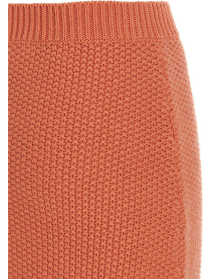 Skirt by Chloé for women in cashmere orange showcases a dramatic silhouette, artfully capturing the essence of the Women's Cashmere Mini Skirt in a dramatic mini cut for a refined look.