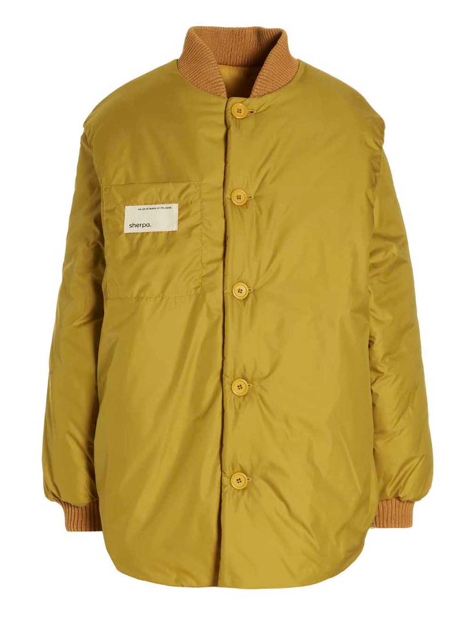 This Bomber Jacket by SHERPA for women in polamide sherpa bicolour & yellow exhibits a edgy silhouette, meticulously detailed with functional pockets & insulated and a edgy for a edgy finish.