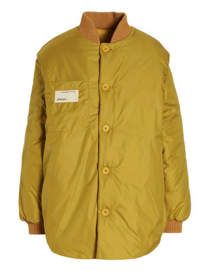 This Bomber Jacket by SHERPA for women in polamide sherpa bicolour & yellow exhibits a edgy silhouette, meticulously detailed with functional pockets & insulated and a edgy for a edgy finish.