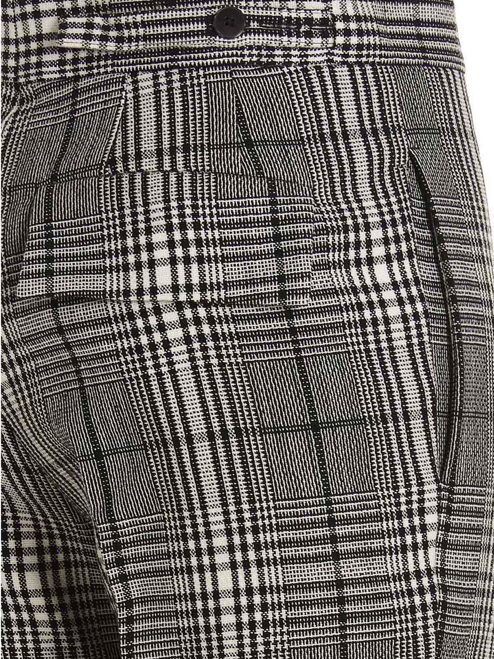 Trousers by SAPIO for women in wool bicolour, black, white & patterned features a tailored silhouette with a tailored straight-leg, defined by its long and a sophisticated .