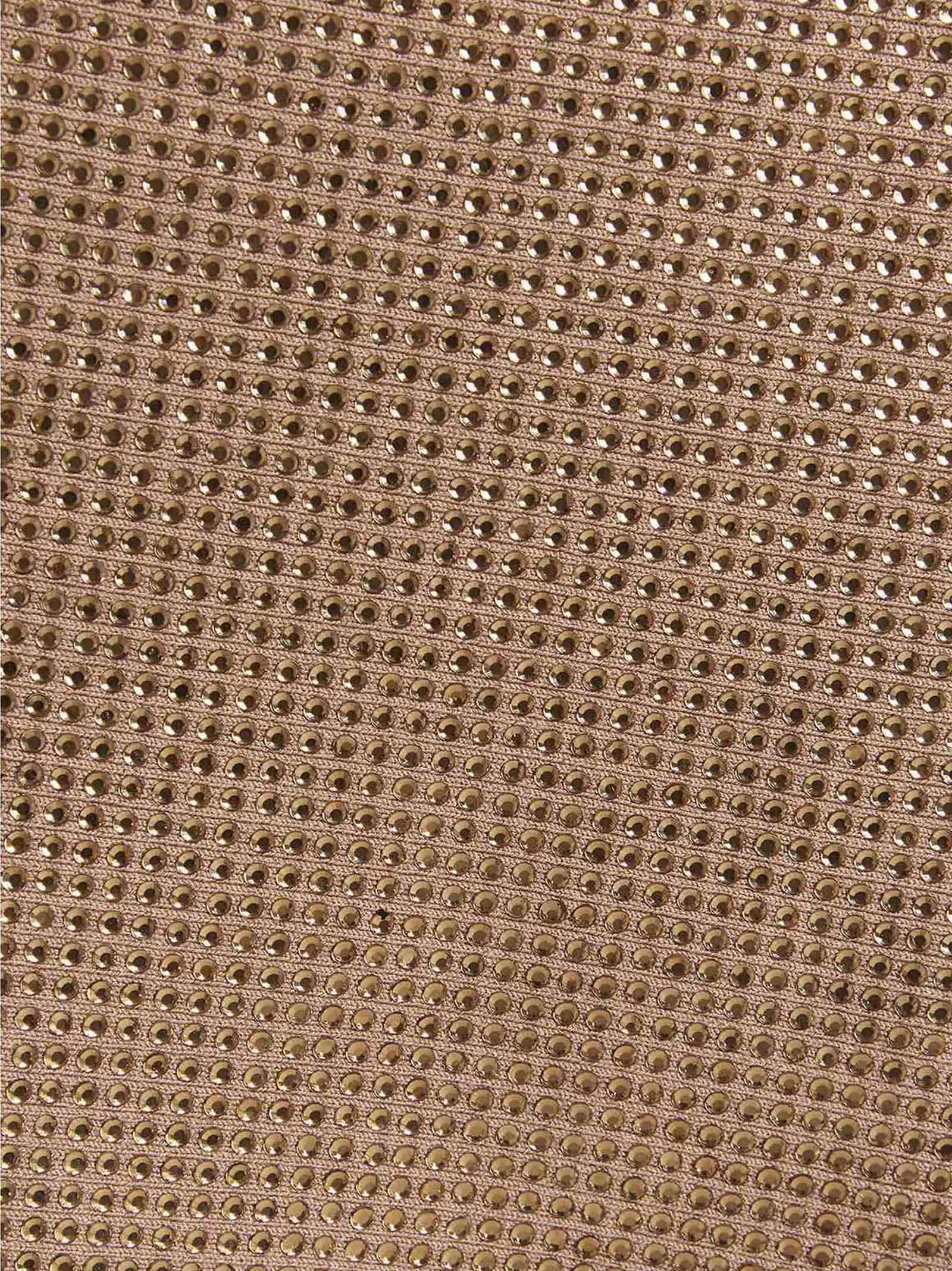 Skirt by ANDREĀDAMO for women in viscose & polyester sequins beige features a contoured silhouette from the Women's Viscose & Polyester Sequins Short Long Skirt collection, characterized by its contoured short long for a contoured finish.