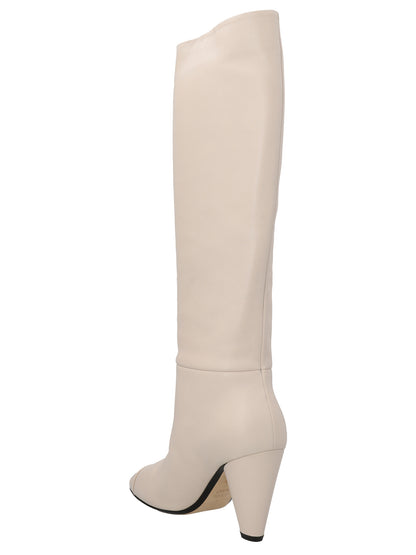 Over-The-Knee Boots by ALEVÌ for women in leather white features an avant-garde Women's Leather Over-The-Knee Boots silhouette, defined by a sophisticated and a avant-garde pointed toe style.