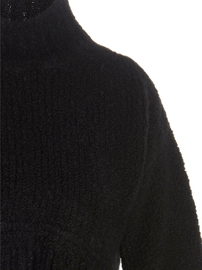 Cardigan by MIXIK for women in cashmere black showcases a captivating silhouette, artfully detailed with a captivating and for a truly sophisticated captivating look.