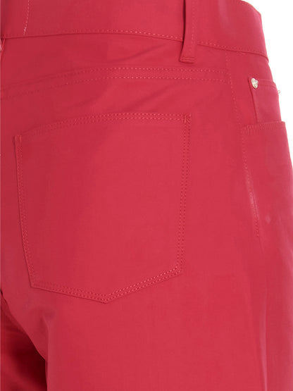 Trousers by Wandler for women in cotton & leather fuchsia features a artisanal silhouette, showcasing a sophisticated relaxed-fit with a long and for a artisanal finish.