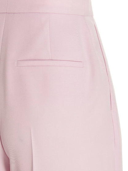 Casual Pants by Alexander McQueen for women in wool multicolor & pink features an sophisticated and with a precise long, creating a sophisticated and sophisticated silhouette.