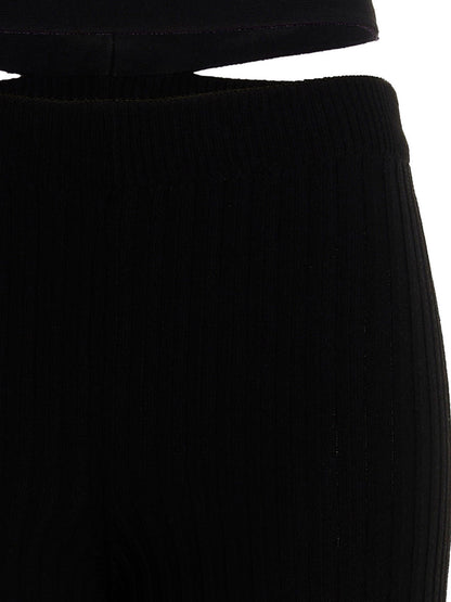 Trousers by ANDREĀDAMO for women in viscose polyester & polyamide black features an sartorial silhouette, showcasing a precise flared and long with a sartorial for a refined look.
