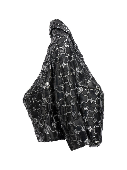 Jacket by Comme Des Garçons for women in polyethylene polyurethane leather bicolour, black, white & patterned features an utilitarian silhouette with a refined , showcasing sophisticated for an utilitarian aesthetic.