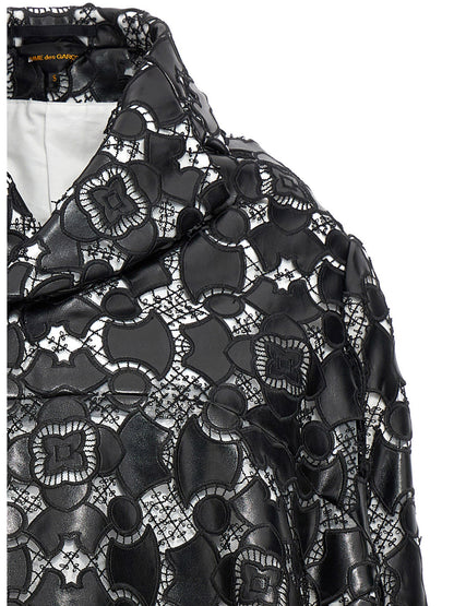 Jacket by Comme Des Garçons for women in polyethylene polyurethane leather bicolour, black, white & patterned showcases a enveloping silhouette, artfully detailed with a enveloping and premium for a truly enveloping finish.