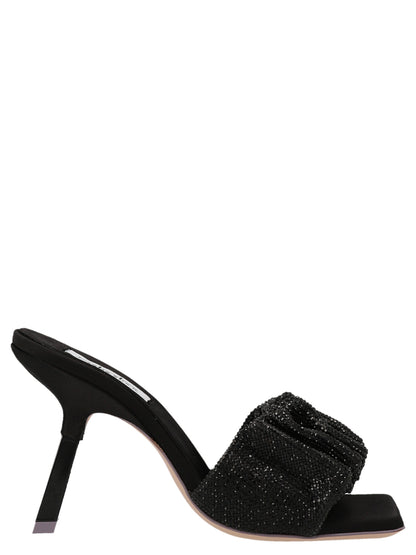 Stiletto Mules Sandals by SEBASTIAN for women in goatskin leather & sequins black features an architectural design from the Women's Goatskin leather & Sequins Stiletto Mules Sandals collection, defined by a architectural stiletto and for a architectural finish.
