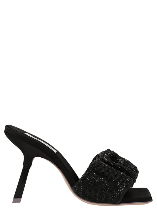 Stiletto Mules Sandals by SEBASTIAN for women in goatskin leather & sequins black features an architectural design from the Women's Goatskin leather & Sequins Stiletto Mules Sandals collection, defined by a architectural stiletto and for a architectural finish.