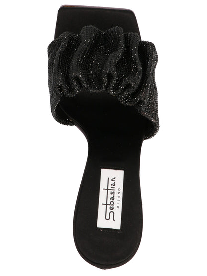 Stiletto Mules Sandals by SEBASTIAN for women in goatskin leather & sequins black presents a sculptural silhouette, showcasing the Women's Goatskin leather & Sequins Stiletto Mules Sandals design with a sculptural stiletto and for a premium look.