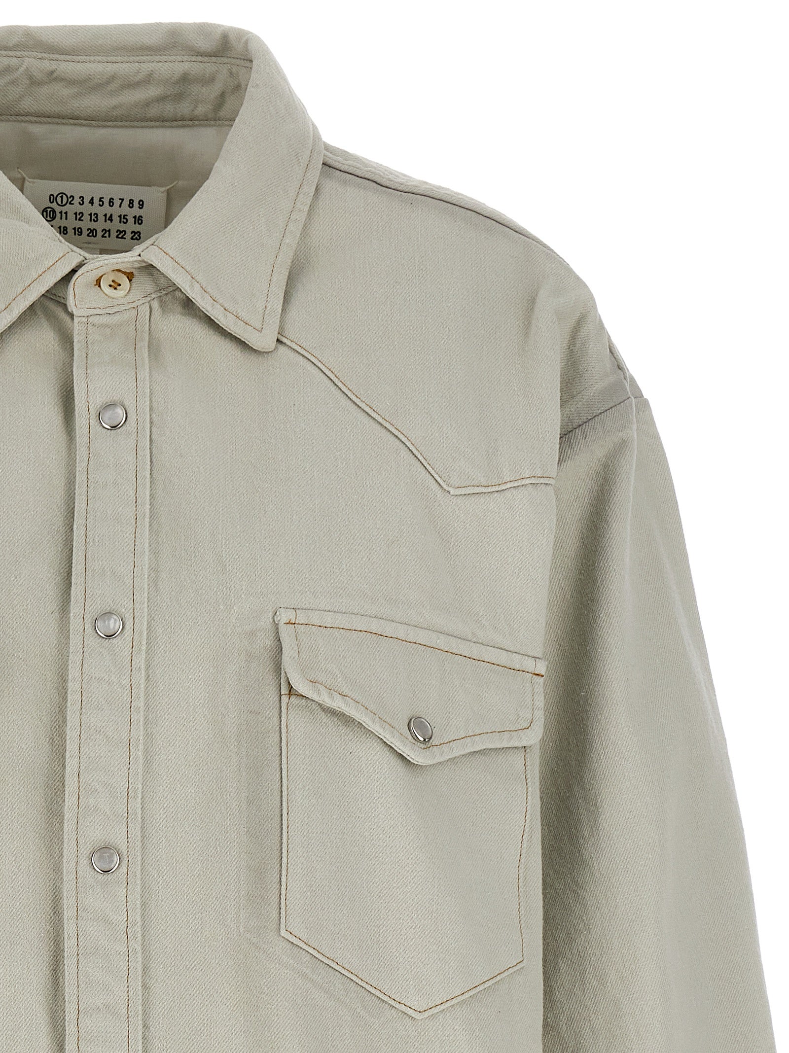 Trucker Jacket by Maison Margiela for women in denim cotton white features a dramatic silhouette, showcasing a sophisticated and distinctive pockets & insulated for a dramatic aesthetic.