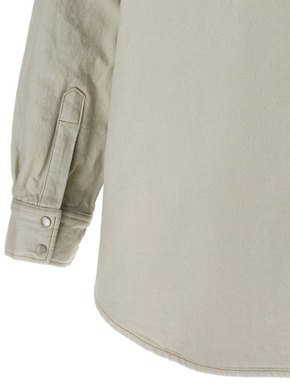 This Trucker Jacket by Maison Margiela for women in denim cotton white exhibits a edgy silhouette, meticulously detailed with functional pockets & insulated and a edgy for a edgy finish.