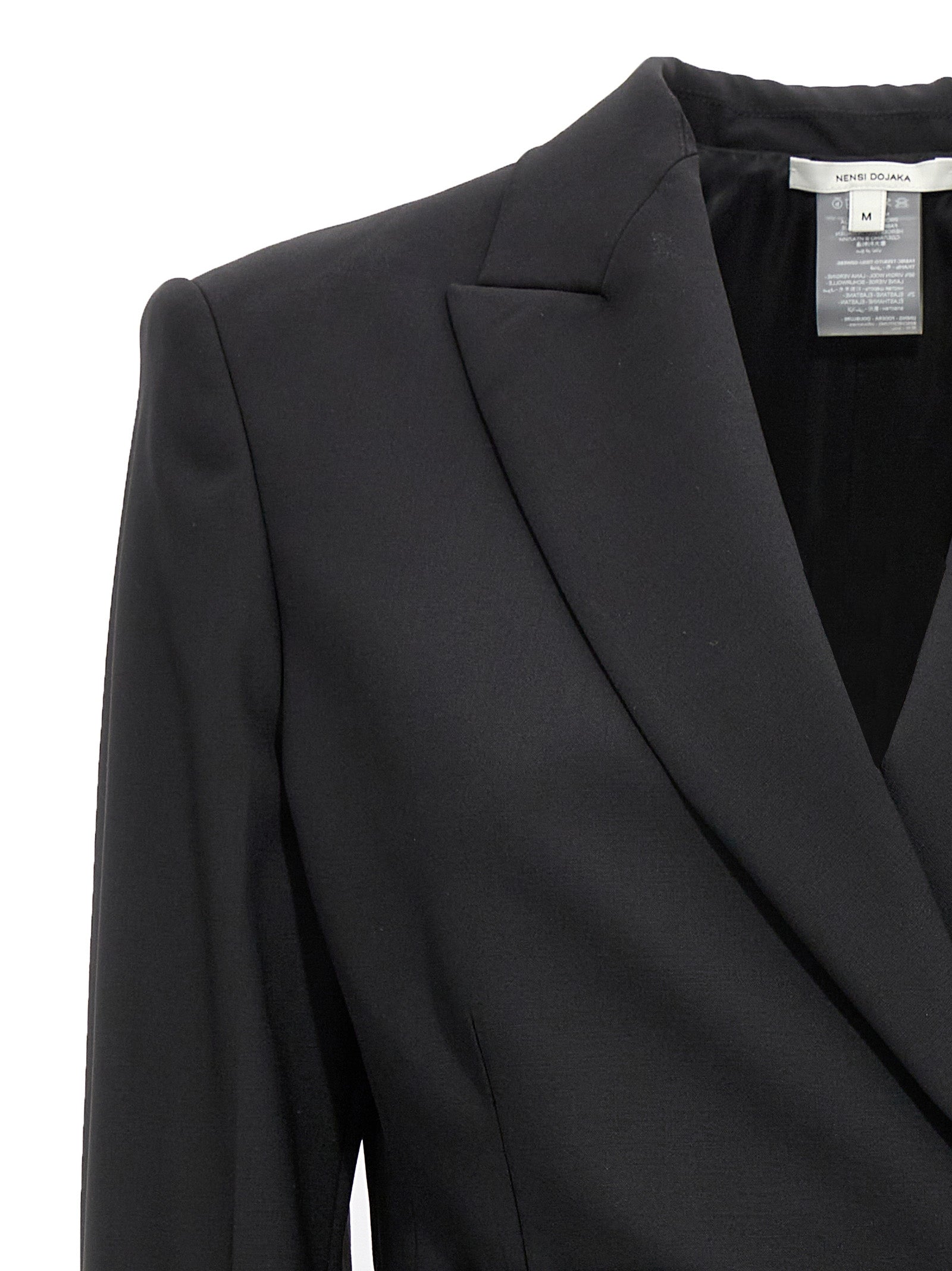 Tuxedo by Nensi Dojaka for women in virgin wool black presents a sartorial silhouette, artfully finished with a sartorial and a sartorial for a truly sophisticated look.