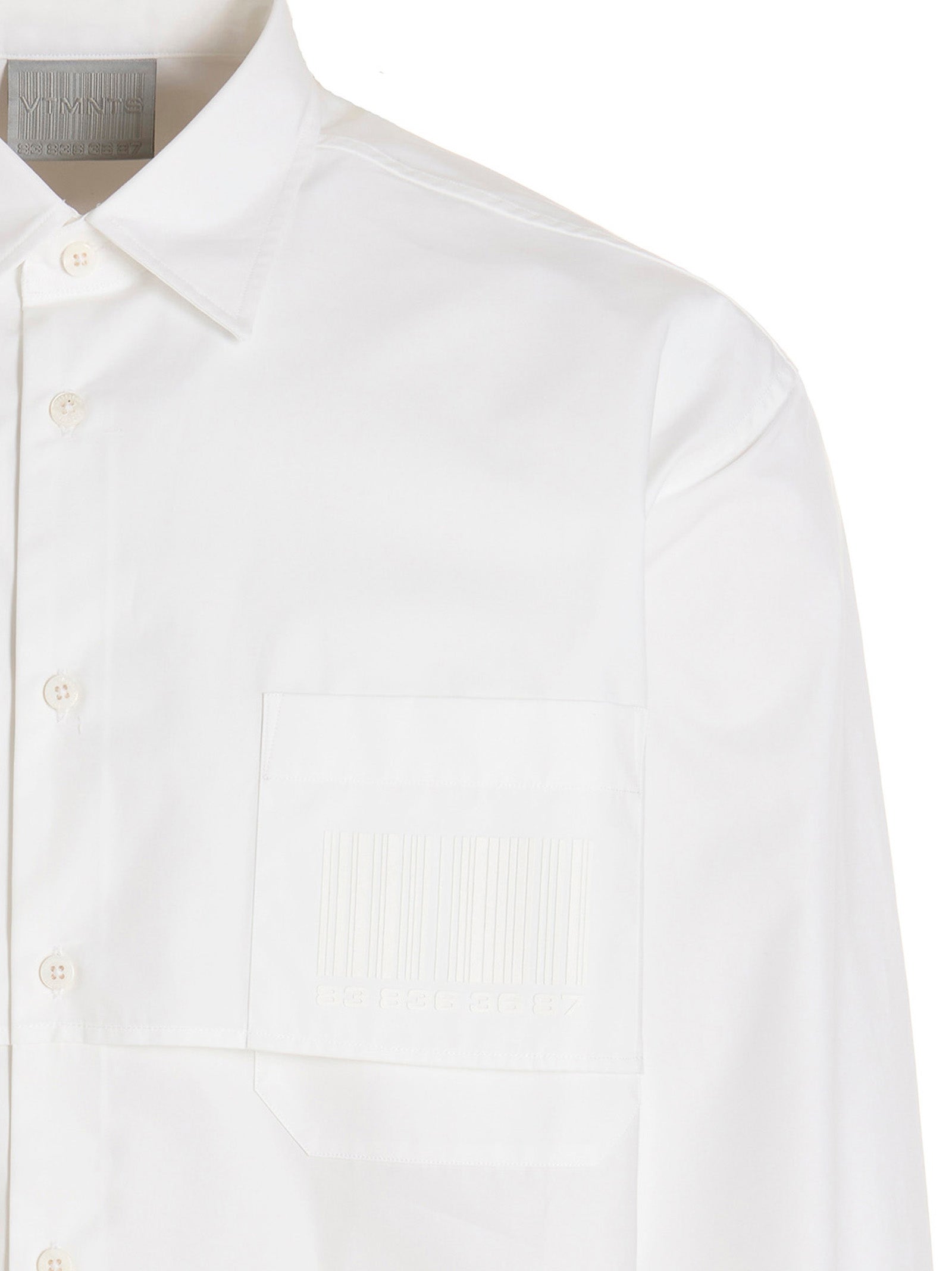 Shirt by VTMNTS for men in cotton white & print showcases a sleek silhouette, elegantly detailed with a sleek and for a sleek finish.