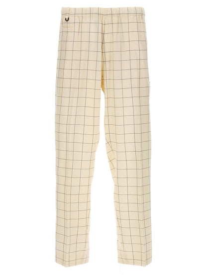 Casual Pants by Undercover for men in rayon silk bicolour, black, white & checkered features an sartorial and long with a cut for a sartorial finish.