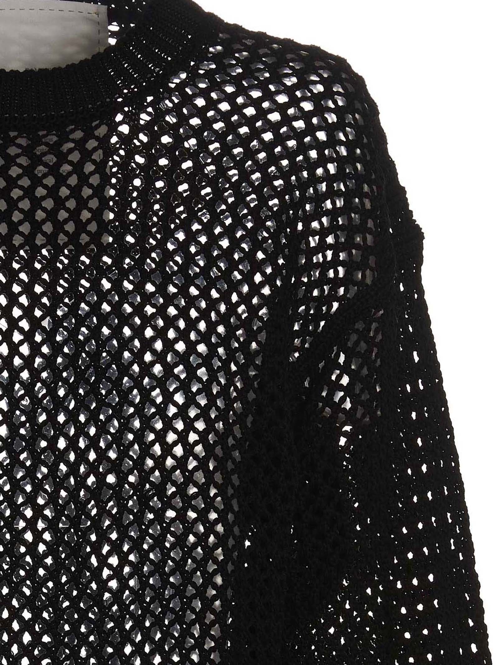 Cardigan by RAMAEL for women in cotton black showcases a luxurious silhouette, meticulously detailed with a sophisticated and for a refined finish.