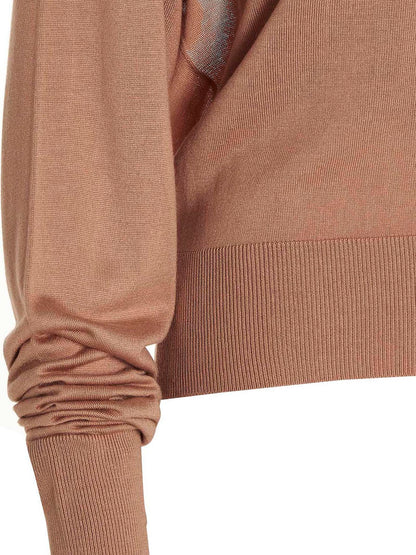 Cardigan by RAMAEL for women in silk beige showcases a luxurious silhouette, meticulously detailed with a sophisticated and for a refined finish.