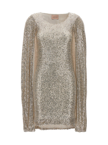 Dress by LE TWINS for women in cashmere polyester & sequins silver features an cute silhouette, detailed with a and that elegantly flows into a cute short.