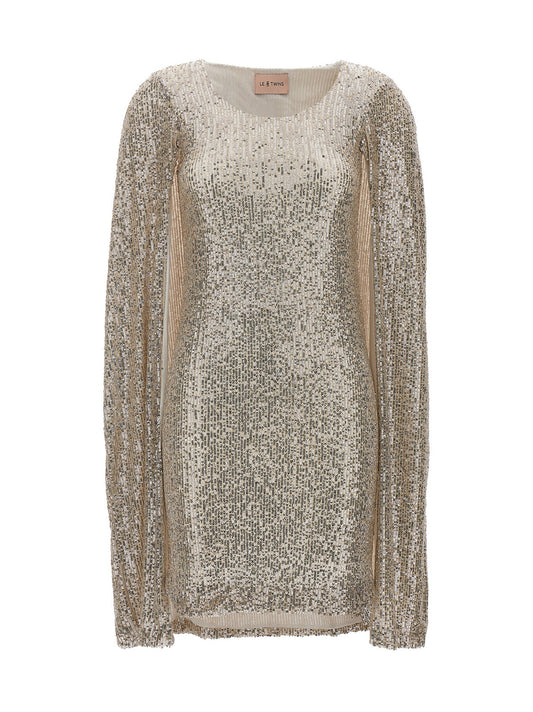Dress by LE TWINS for women in cashmere polyester & sequins silver features an cute silhouette, detailed with a and that elegantly flows into a cute short.