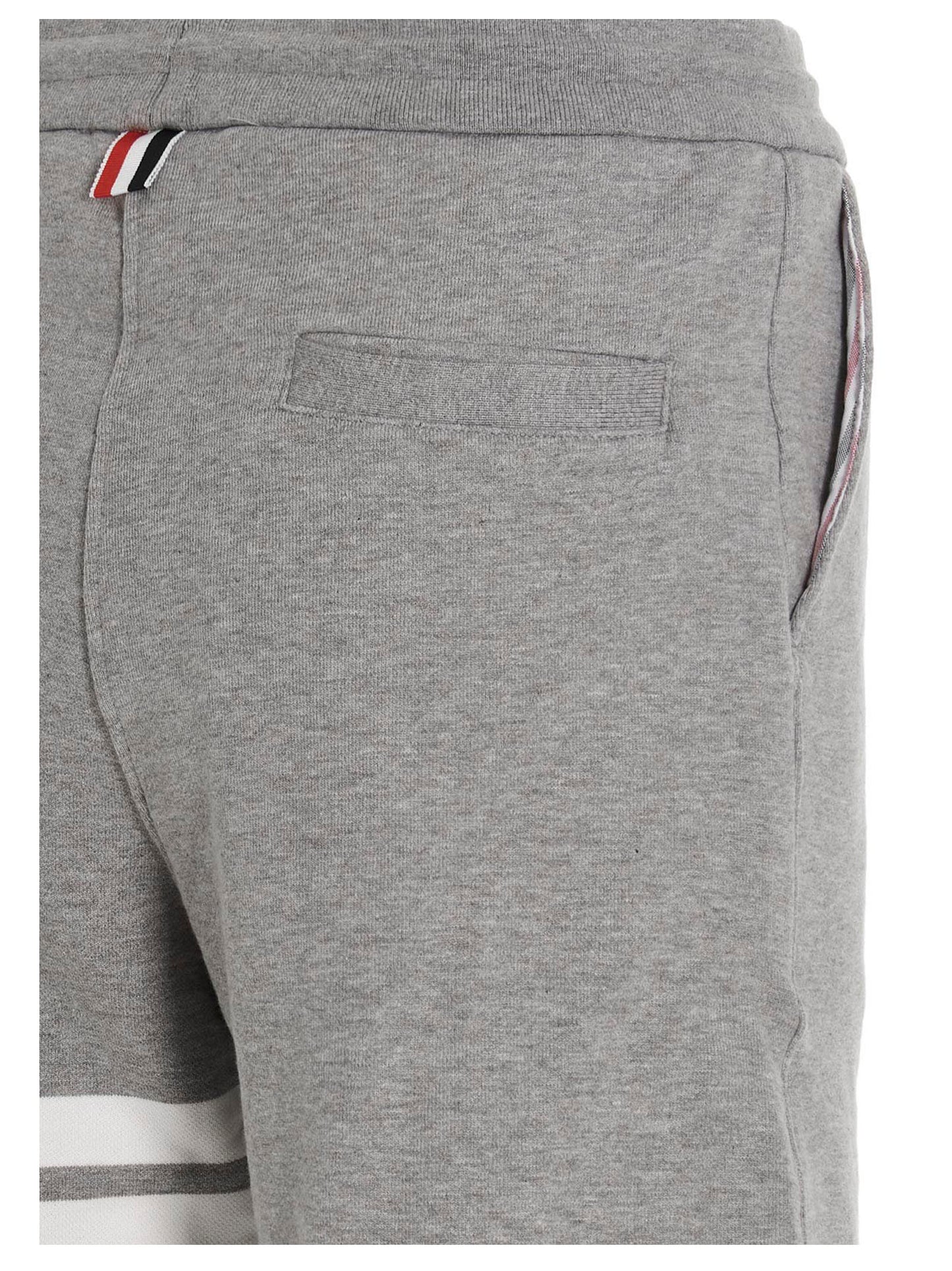 Joggers by Thom Browne for men in cotton gray features an sartorial and long with a cut for a sartorial finish.
