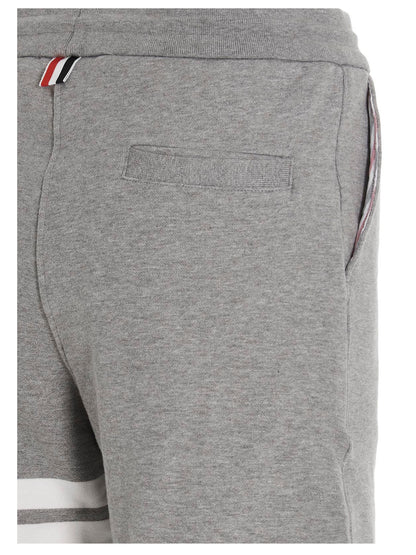Joggers by Thom Browne for men in cotton gray features an sartorial and long with a cut for a sartorial finish.