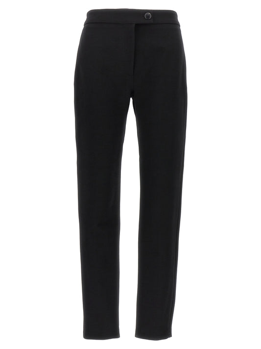 Trousers by Ferragamo for women in polyester & wool black features a sculptural silhouette, showcasing a sculptural skinny-leg & skinny and long with a sophisticated for a sculptural finish.