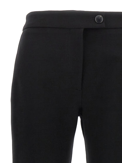 Trousers by Ferragamo for women in polyester & wool black presents a smart silhouette, meticulously detailed with a smart skinny-leg & skinny, a smart long, and a smart .