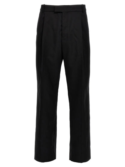 Trousers by Alexander McQueen for men in wool black features an on trend silhouette, showcasing a sophisticated with a long and for an on trend finish.