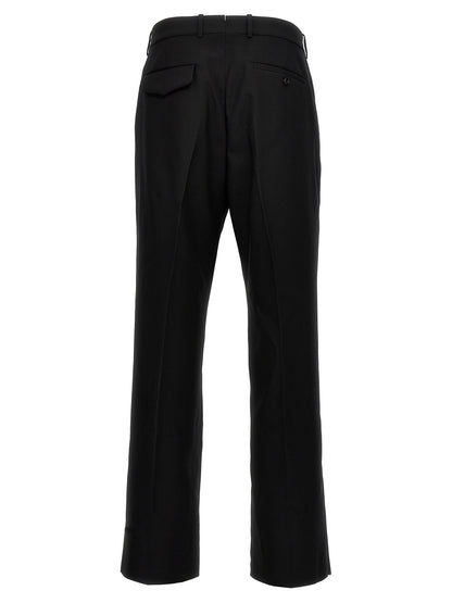 Trousers by Alexander McQueen for men in wool black presents a perennial silhouette, meticulously tailored with a cut, long finish, and an elegant .